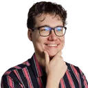 Max Altena, smiling, in glasses and a striped shirt